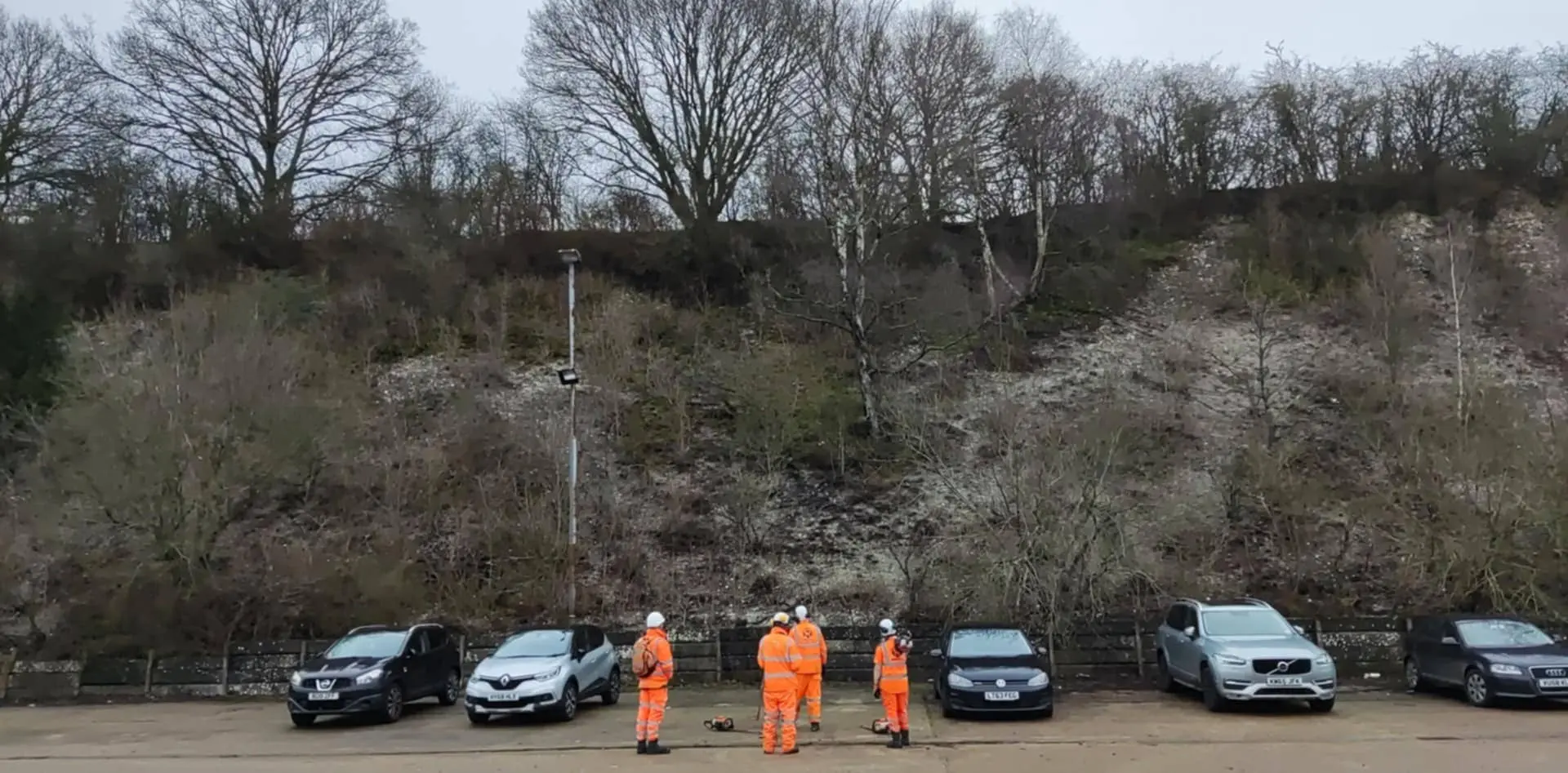 workers assembled to assess site